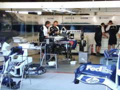 Mechanics working on a BMW Williams FW27
